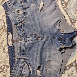 Torrid light wash denim shorts Size 14 distressed raw hem Very Cute !